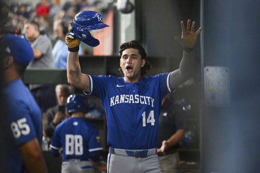 Kansas City Royals' Jac Caglianone celebrates in the dugout after hitting his first career home run during a baseball game against the Texas Rangers