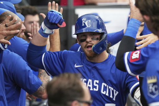 Kansas City Royals' Bobby Witt Jr. celebrates with teammates after hitting a two-run home run during the ninth inning of a baseball game against the Chicago White Sox in Chicago