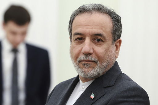 Iranian Foreign Minister Abbas Araghchi stands waiting to meet Russian President Vladimir Putin for the talks at the Kremlin in Moscow
