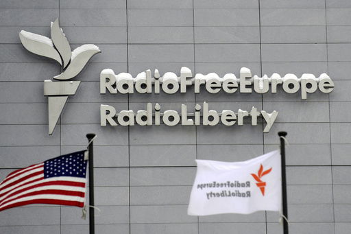 FILE - The headquarters of Radio Free Europe/Radio Liberty (RFE/RL) is seen with the American flag in the foreground
