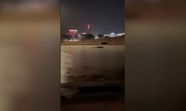 The roofs of some vehicles were seen peeking out of floodwaters on Interstate 35 just outside of San Antonio