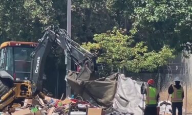 A group of homeless people in West Berkeley was awakened Wednesday morning by a swarm of police and city workers