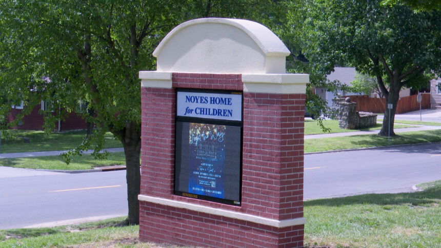 Noyes Home Electric Sign