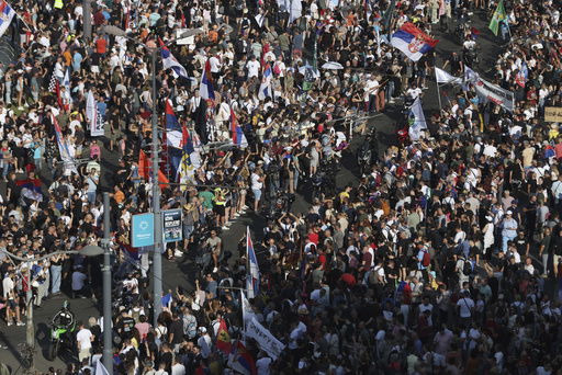 People attend a major anti-government rally to press their demand for an early election after nearly eight months of almost daily anti-corruption demonstrations that have shaken the populist government of President Aleksandar Vucic