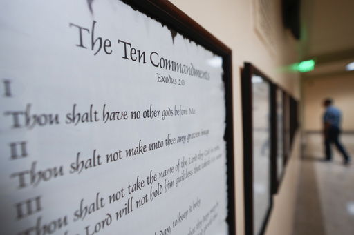 FILE - A copy of the Ten Commandments is posted along with other historical documents in a hallway at the Georgia Capitol on June 20