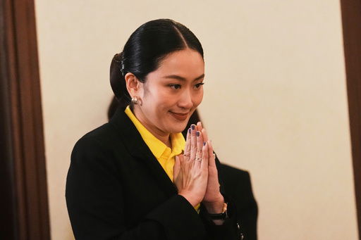 Thailand's Prime Minister Paetongtarn Shinawatra arrives to talk to reporters at Government house in Bangkok