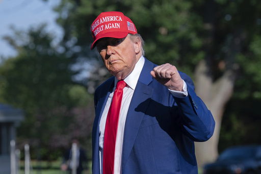 President Donald Trump walks on the South Lawn upon arriving at the White House