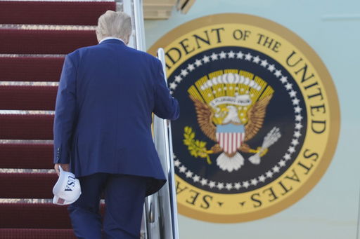 President Donald Trump boards Air Force One
