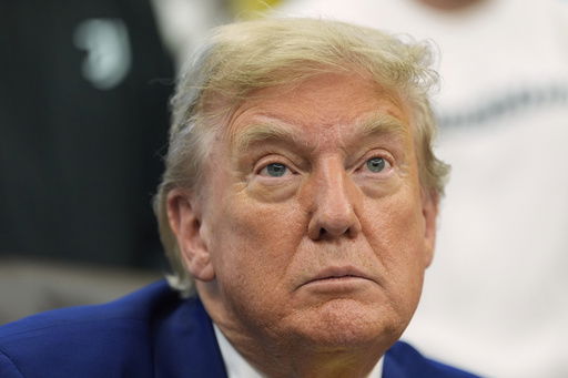 President Donald Trump talks with reporters as he meets with members of the Juventus soccer club in the Oval Office of the White House
