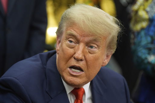 President Donald Trump answers questions from reporters as he meets with Congo's Foreign Minister Therese Kayikwamba Wagner