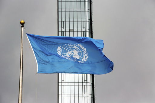 FILE - The United Nations flag flies on a stormy day at the U.N. during the United Nations General Assembly