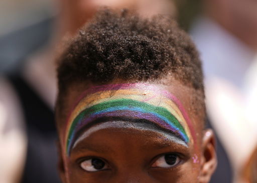 A child watches the World Pride parade