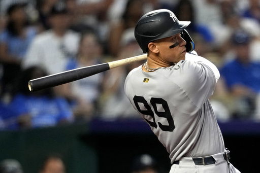 New York Yankees' Aaron Judge hits a home run in the seventh inning during a baseball game against the Kansas City Royals