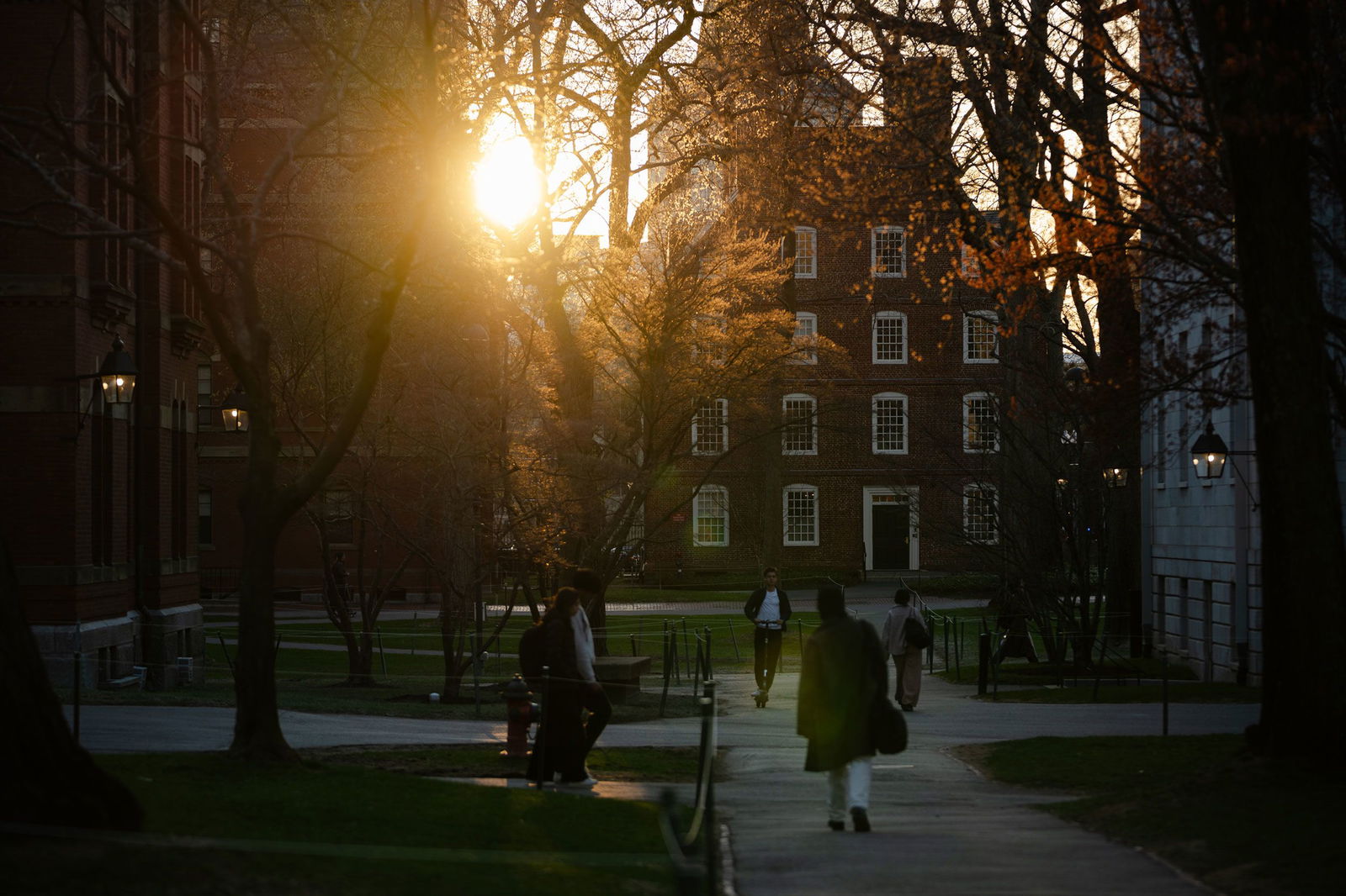 <i>Sophie Park/Getty Images via CNN Newsource</i><br/>Students walk through Harvard University's campus on April 17 in Cambridge