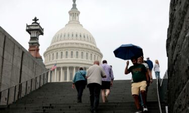 Tourists walk near the US Capitol visitor center on June 16 in Washington
