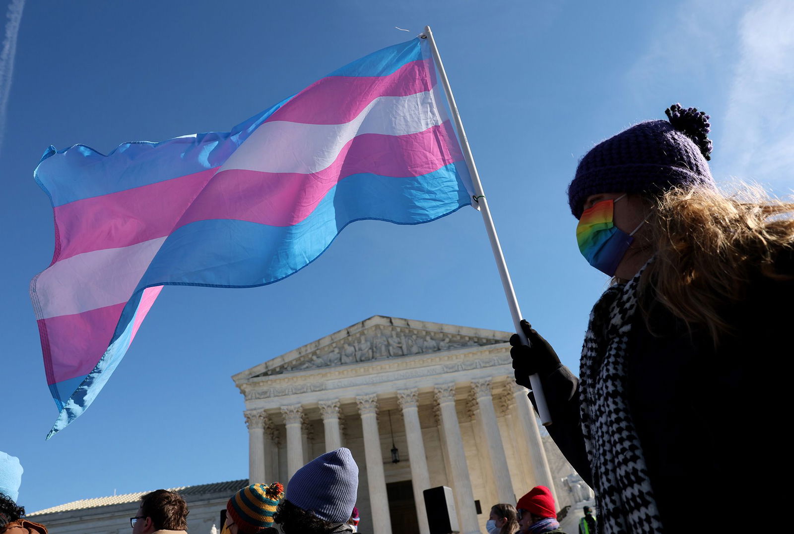 <i>Kevin Dietsch/Getty Images via CNN Newsource</i><br/>A transgender rights supporter takes part in a rally outside of the US Supreme Court as the high court hears arguments in a case on transgender health rights on December 4