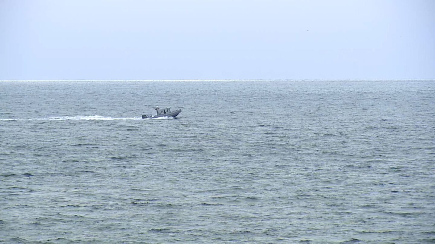 <i>KGTV via CNN Newsource</i><br/>A boat searches for survivors of a plane crash near Point Loma