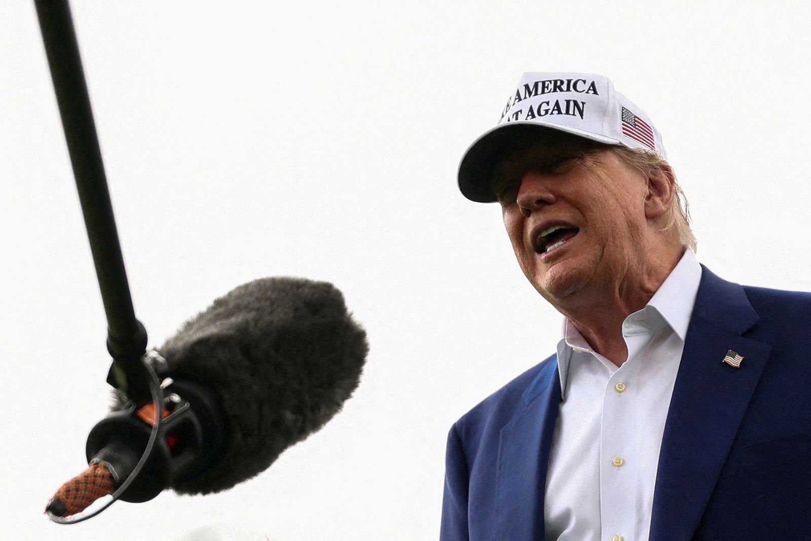 <i>Kevin Lamarque/Reuters via CNN Newsource</i><br/>President Donald Trump speaks to members of the media during the installation of a new flagpole on the South Lawn at the White House.