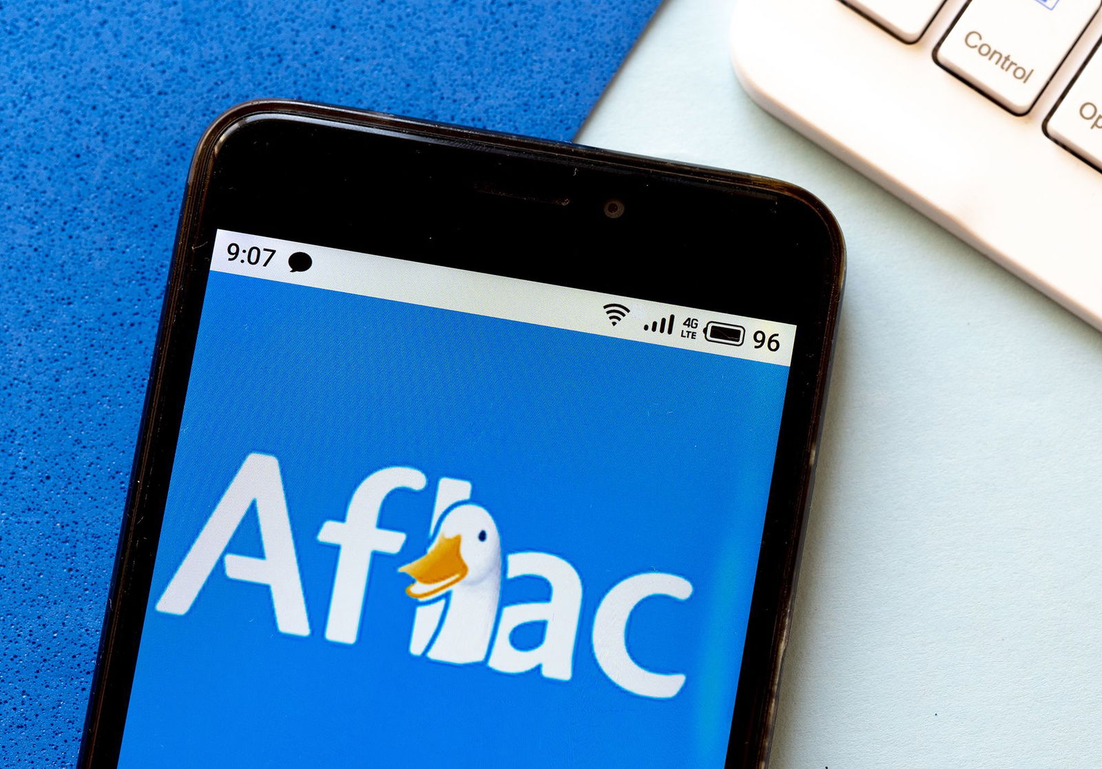 <i>Igor Golovniov/SOPA Images/LightRocket/Getty Images via CNN Newsource</i><br/>In this photo illustration an Aflac logo is seen displayed on a smartphone.