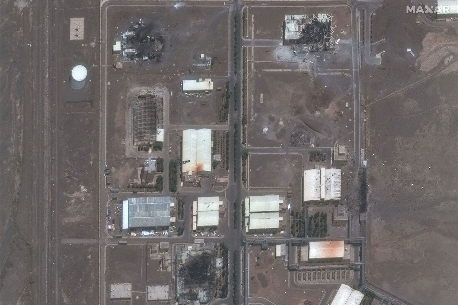 <i>Maxar Technologies via CNN Newsource</i><br/>A satellite image shows damaged buildings at Iran's Natanz Nuclear Facility on June 14 after a series of Israeli strikes.