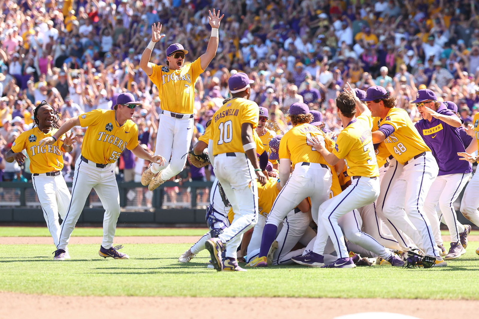 <i>Tyler McFarland/NCAA Photos/Getty Images via CNN Newsource</i><br/>The LSU Tigers celebrate after winning the program's second national championship in three years.