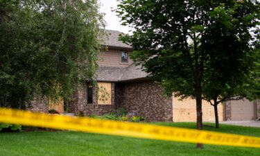 Police are seen outside of Rep. Melissa Hortman's home in Brooklyn Park