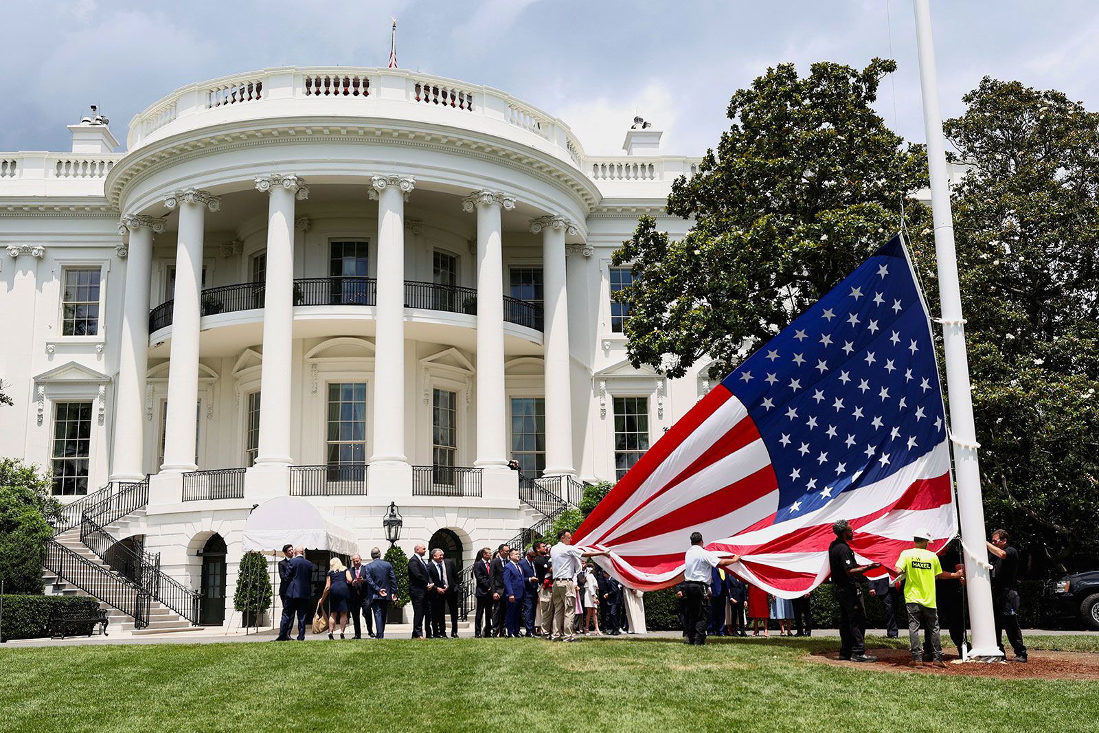 <i>Evan Vucci/AP via CNN Newsource</i><br/>President Donald Trump speaks as a flagpole is installed on the South Lawn of the White House on June 18