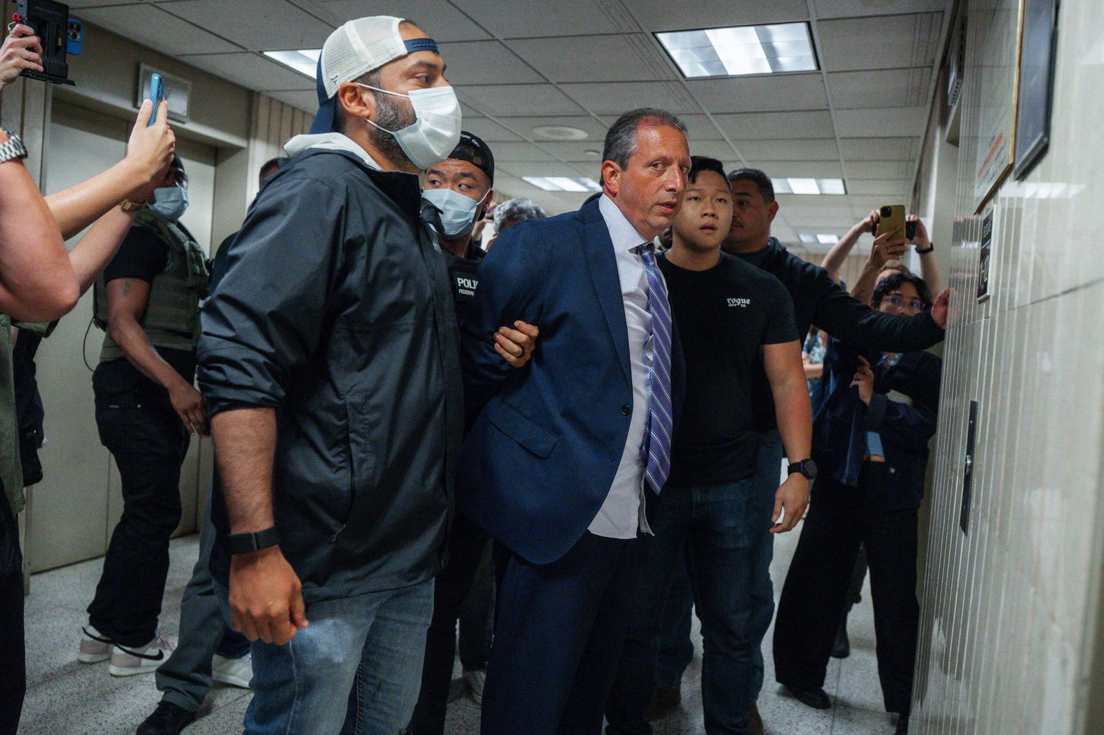 <i>Olga Fedorova/AP via CNN Newsource</i><br/>New York City Comptroller Brad Lander is placed under arrest by Immigration and Customs Enforcement (ICE) and FBI agents outside federal immigration court on Tuesday