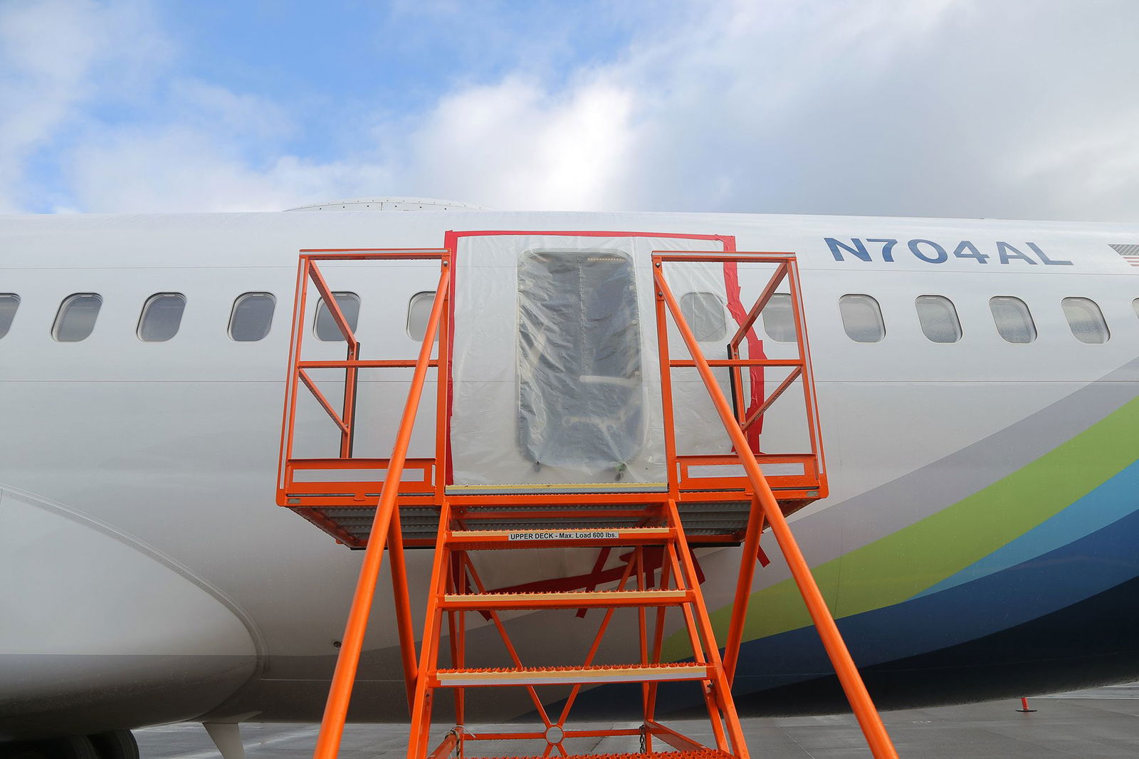 <i>NTSB/Getty Images via CNN Newsource</i><br/>Plastic covers the exterior of the fuselage plug area of Alaska Airlines Flight 1282 Boeing 737-9 MAX in January 2024 in Portland