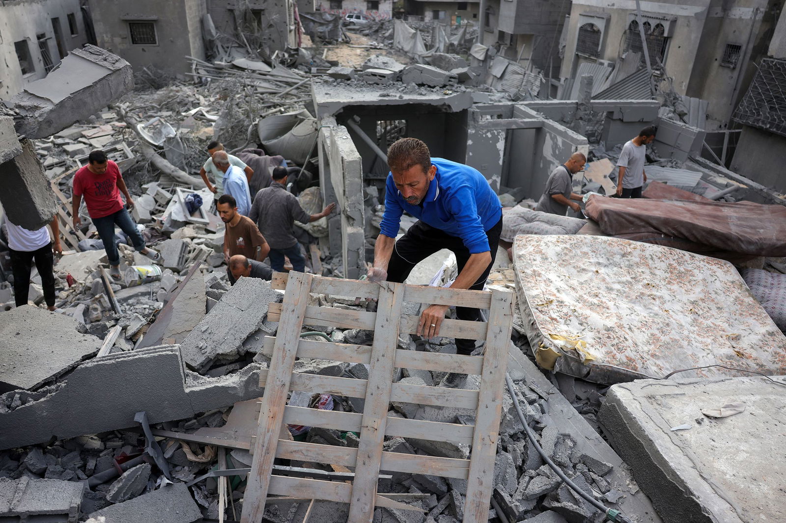 <i>Bashar Taleb/AFP/Getty Images via CNN Newsource</i><br/>Palestinians search for survivors from the rubble of a home that was hit by an Israeli strike