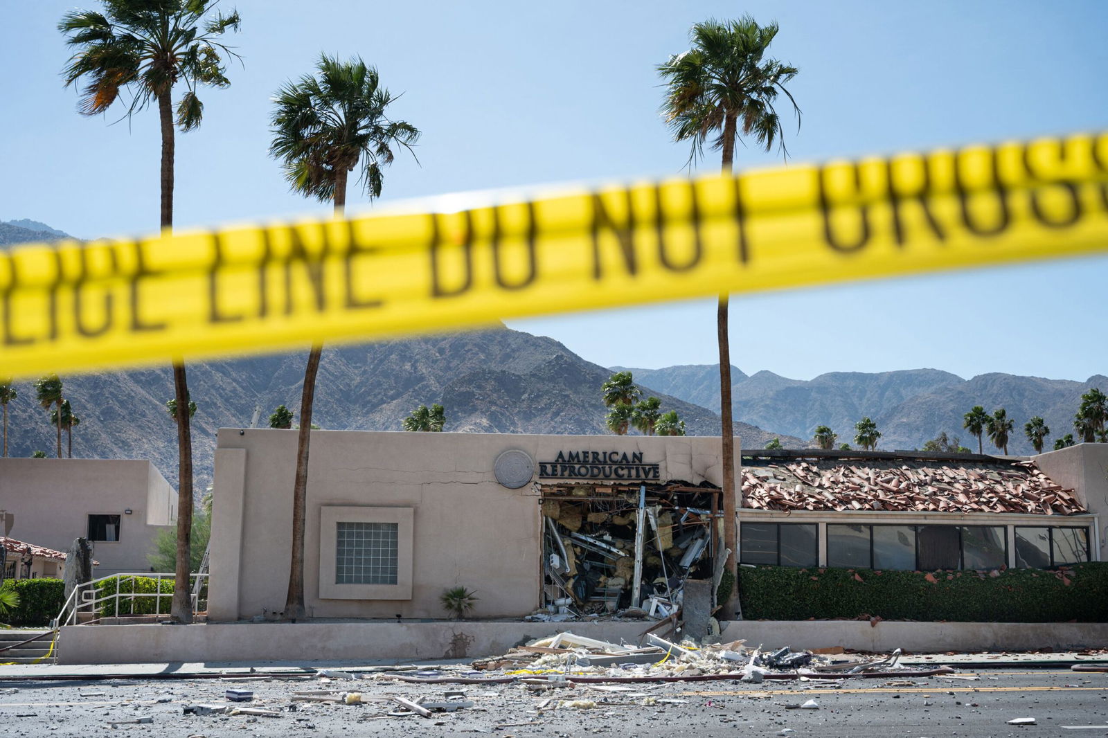 <i>Gabriel Osorio/AFP/Getty Images via CNN Newsource</i><br/>A police line is seen outside a damaged American Reproductive Centers fertility clinic after a bomb blast outside the building in Palm Springs