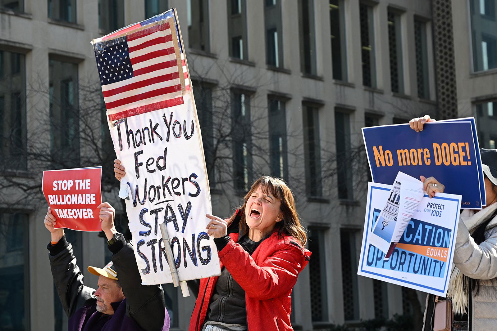 <i>Alex Wroblewski/AFP/Getty Images via CNN Newsource</i><br/>Protesters hold signs in solidarity with the American Federation of Government Employees of District 14 at a rally in support of federal workers at the Office of Personnel Management in Washington