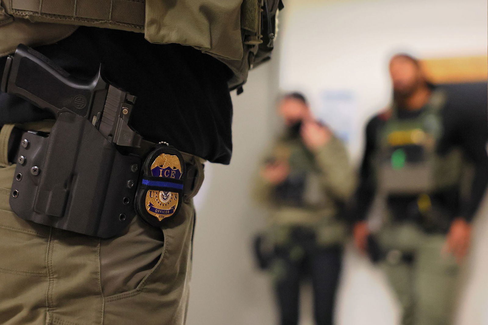 <i>Michael M. Santiago/Getty Images via CNN Newsource</i><br/>An ICE officer's badge is seen as federal agents patrol the halls of immigration court at the Jacob K. Javitz Federal Building in New York City.