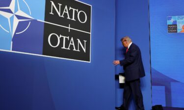 President Donald Trump leaves following a press conference at the NATO summit in The Hague