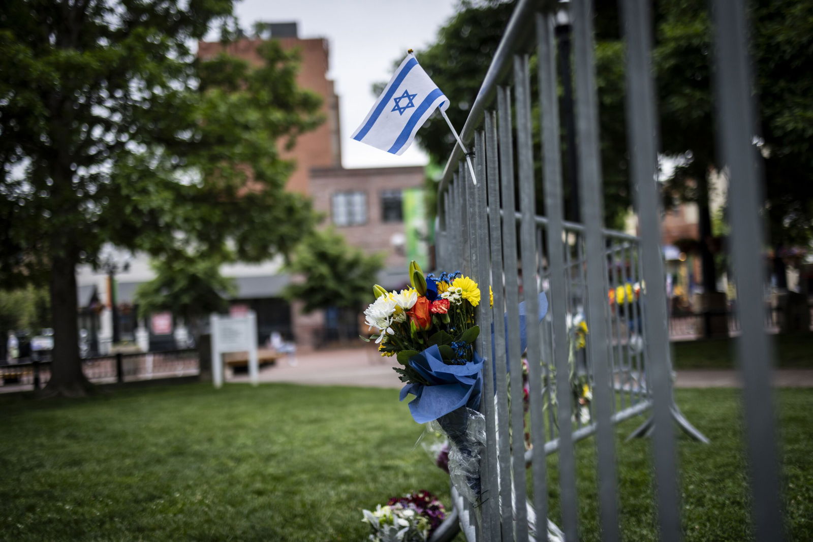 <i>Chet Strange/Getty Images via CNN Newsource</i><br/>Flowers and a flag at the site of the attack outside the Boulder County Courthouse in Boulder