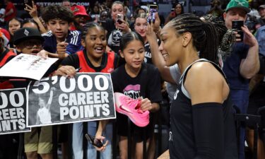 Wilson (left) had 22 points in the Aces' win over the Sun.