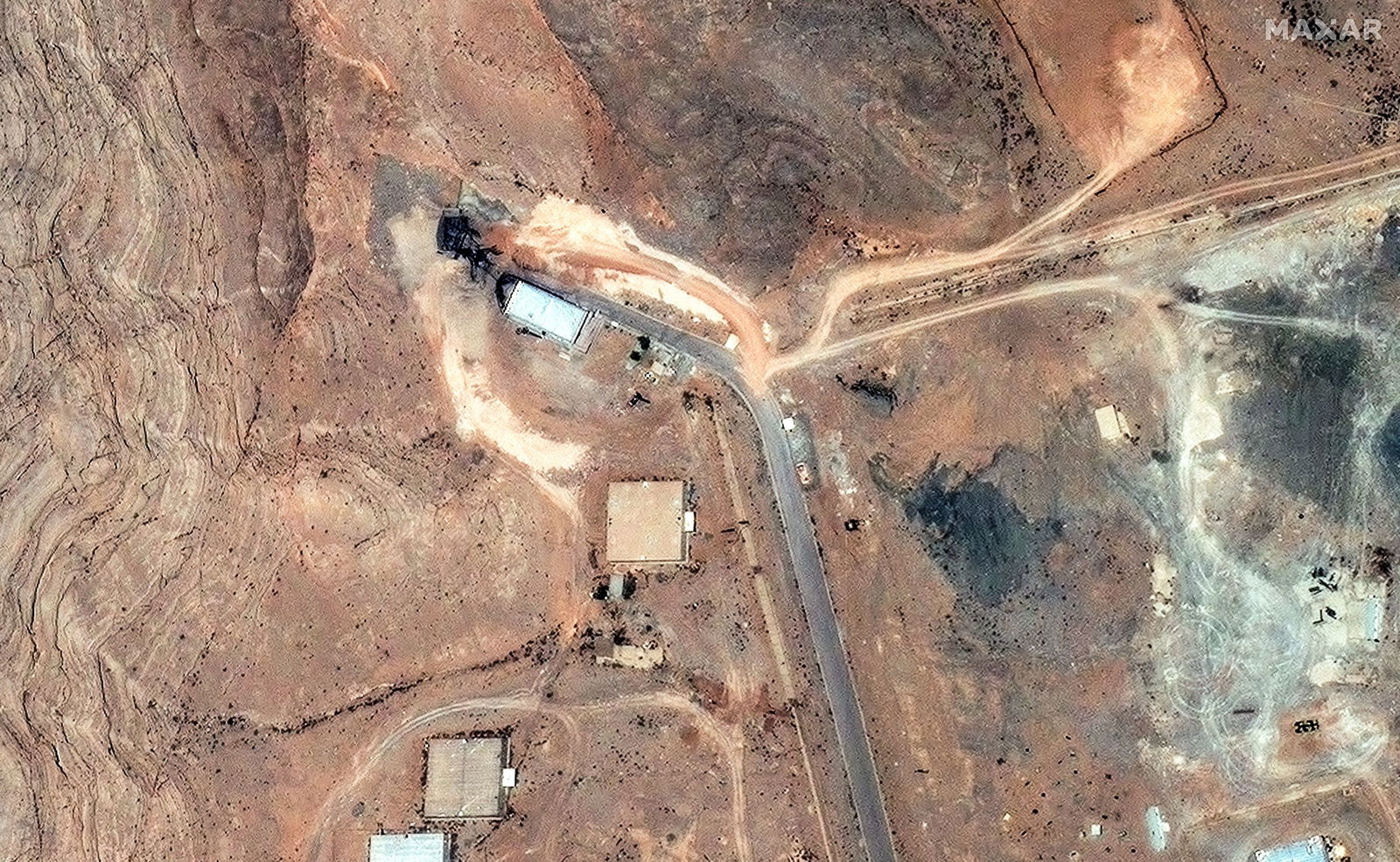 <i>Maxar Technologies/Handout/Reuters via CNN Newsource</i><br/>A satellite image shows damage to the tunnel entrances of the Isfahan Nuclear Technology Research Center in Isfahan