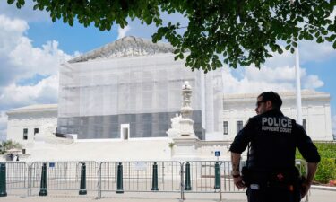 A US Supreme Court police officer stands watch outside of the Supreme Court on June 26 in Washington