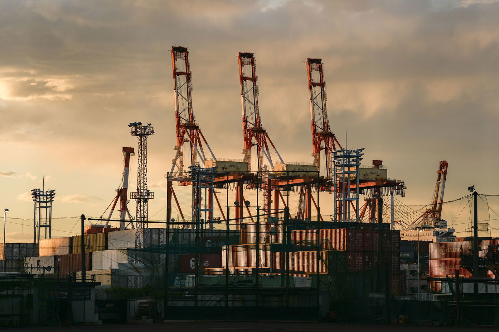 <i>Toru Hanai/Bloomberg/Getty Images via CNN Newsource</i><br/>Containers under gantry cranes at a shipping terminal in Yokohama