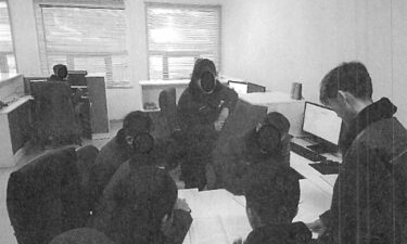 This photo from the US District Court District of Massachusetts shows North Korean information technology workers on a multi-member team that the US Department of Justice says works with the North Korean government to fund its regime. Note: Parts of the image provided by the US District Court District of Massachusetts have been obscured.