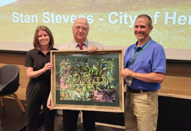 Stan Stevens (middle) received the 2024 Individual Abror Award of Excellence for his decades-long work promoting trees in the city of Hermann. Pictured with Stevens is MCFC Chair Sarah Crowder and MDC Community and Private Lands Branch Chief Jason Jensen.