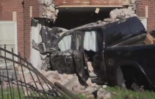 Four people were taken to the hospital after a pickup truck rammed into a brick apartment building in the Woodlawn neighborhood Saturday morning.