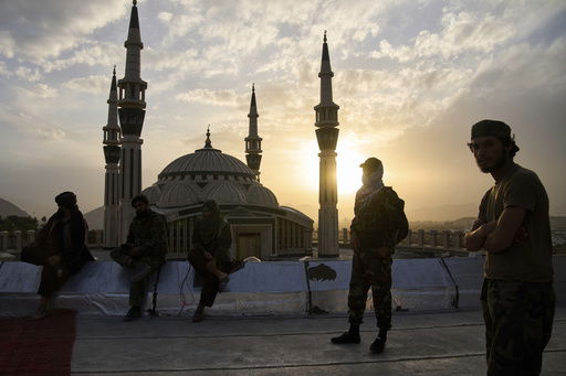 Taliban fighters stand guard on Nadir Khan hill in Kabul