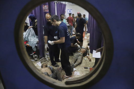 Palestinians who were injured during a food distribution at a center run by the Gaza Humanitarian Foundation