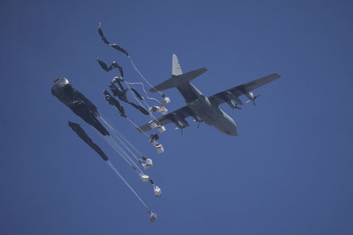 Humanitarian aid is airdropped to Palestinians over Gaza City