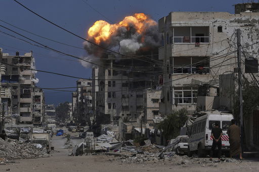 Smoke and flames erupt from an Israeli airstrike in Gaza City