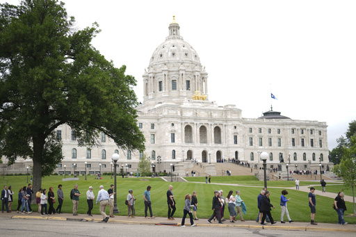 People wait in line to pay their respects to Minnesota state Rep. Melissa Hortman