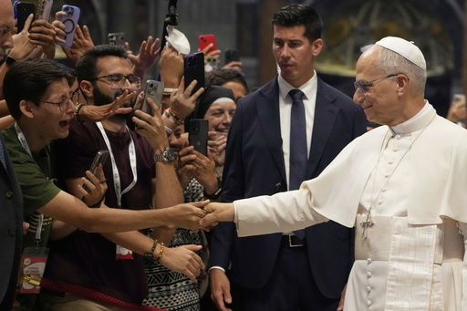 Pope Leo XIV greets faithful at the end of a mass celebrated by Cardinal Luis Antonio Tagle in St. Peter's Basilica on the occasion of the Youth Jubilee at the Vatican