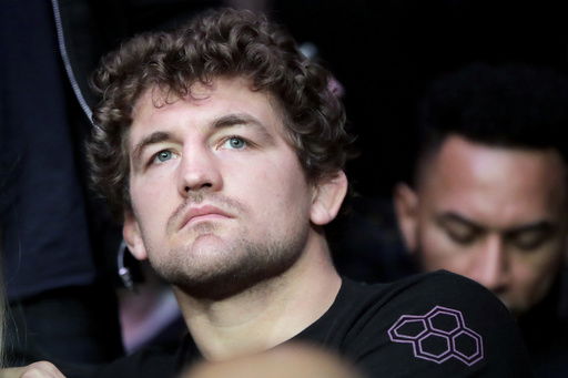 FILE - UFC fighter Ben Askren waits for the start of a middleweight mixed martial arts bout between David Branch and Jared Cannonier at UFC 230
