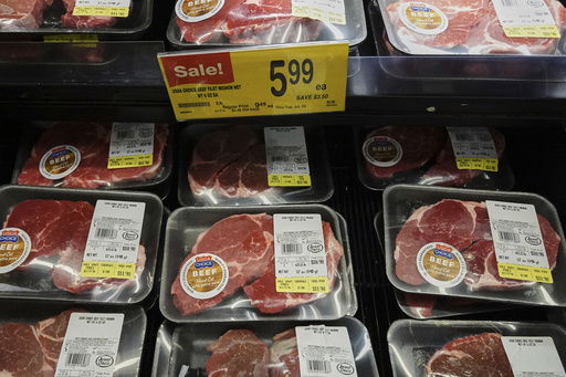 FILE - A price for beef is displayed on a shelf at a grocery store in Mount Prospect